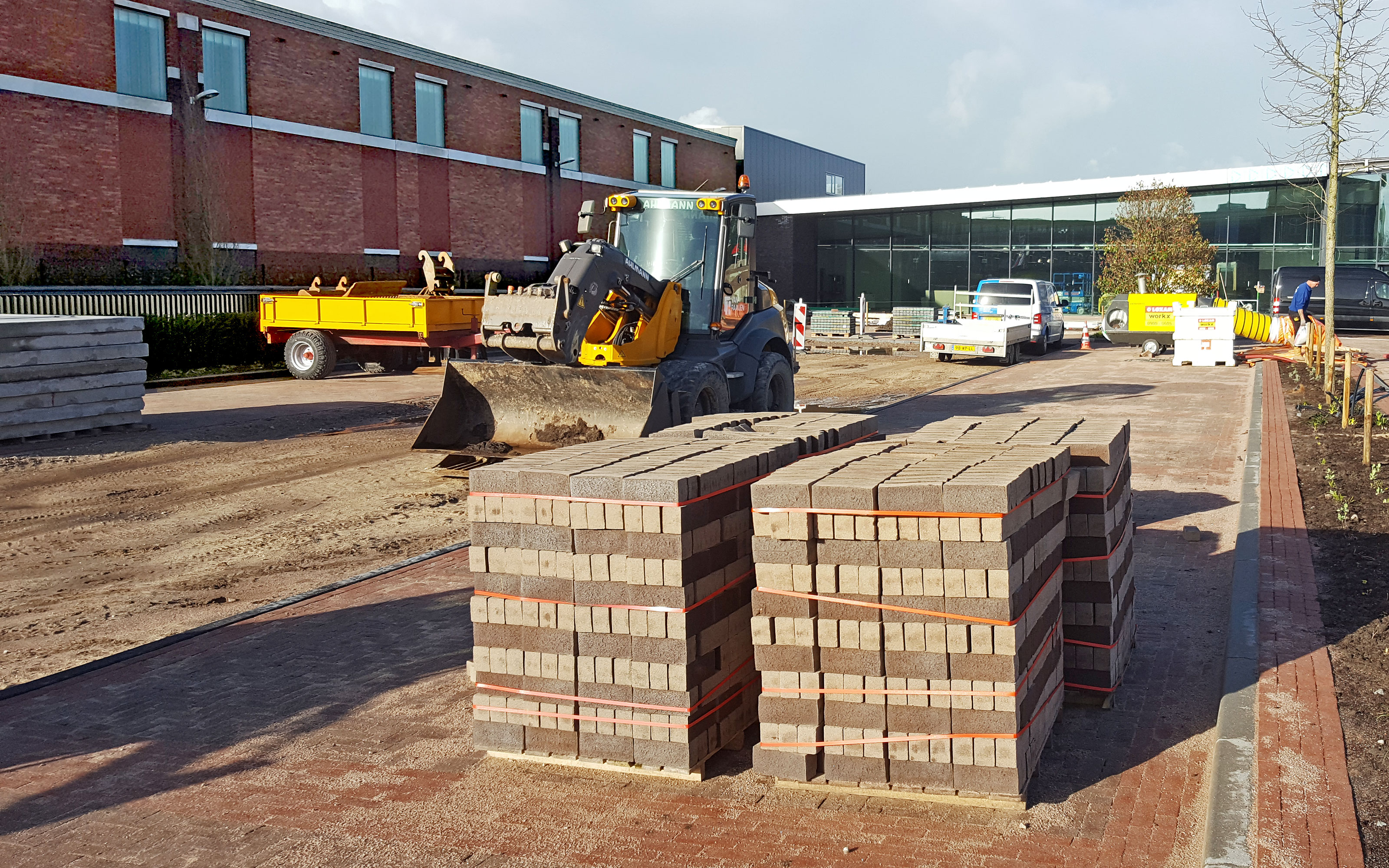 Concrete pavers and construction vehicle on a building site